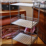 F90. Metal and wicker shelf.